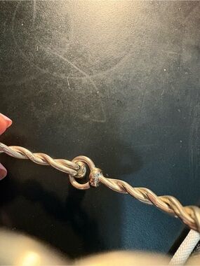 Twisted silver bracelet with 14K gold ball and accent